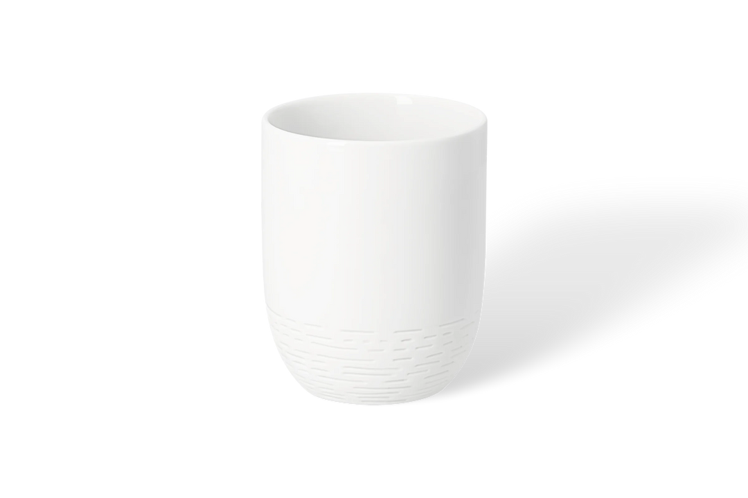 Porcelāna krūze ar taksīti uz skrituļdēļa
