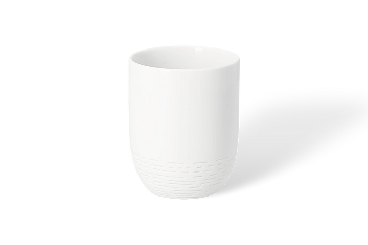 Porcelāna krūze ar taksīti uz skrituļdēļa
