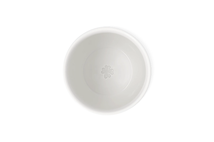 Porcelāna krūze ar taksīti uz skrituļdēļa